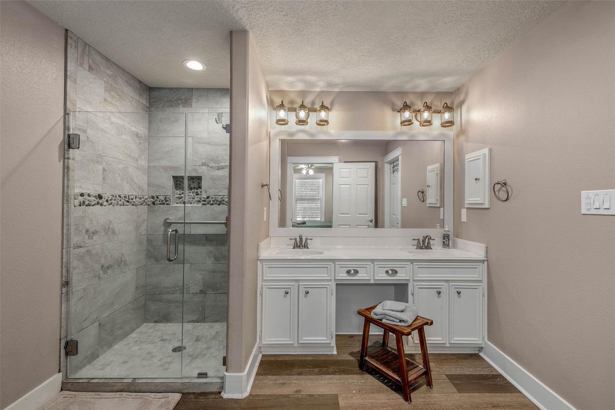 Bathroom, Dual Sink Vanities, Glass Shower, Interior, Recessed Lighting, Wood Texture Flooring