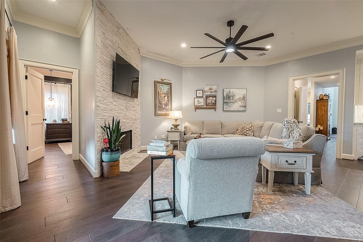 Fireplace, Interior, Living room, Recessed Lighting, Stone Walls, Wood Texture Flooring