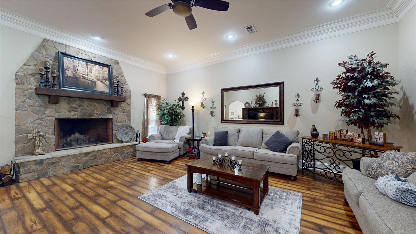 Fireplace, Interior, Living room, Recessed Lighting, Stone Walls, Wood Texture Flooring