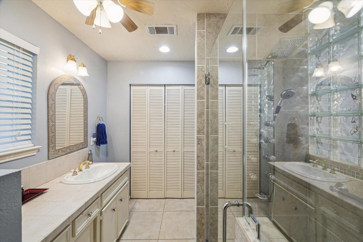 Bathroom, Dual Sink Vanities, Glass Shower, Interior, Recessed Lighting, Tile Countertops
