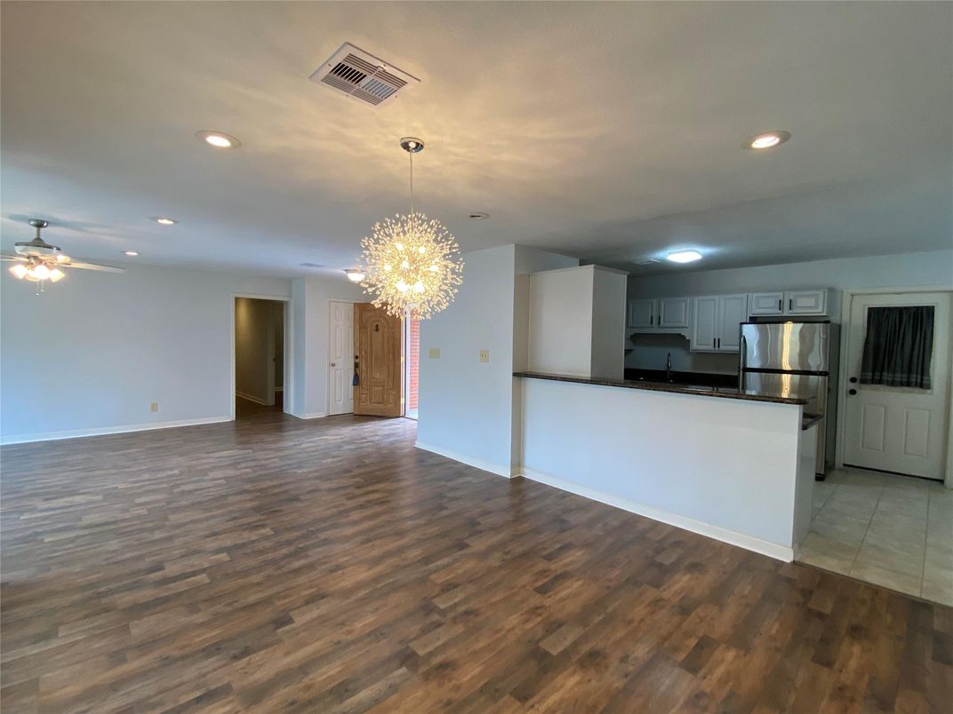 Chandelier, Empty room, Interior, Kitchen, Recessed Lighting, Stainless Steel Appliances, Wood Texture Flooring
