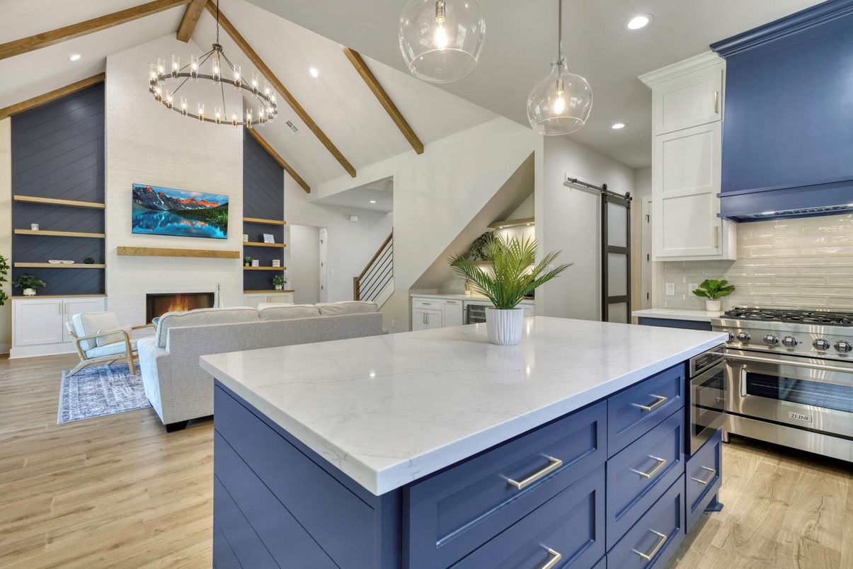 Chandelier, Fireplace, Interior, Kitchen, Living room, Pendant Lights, Recessed Lighting, Stainless Steel Appliances, Wood Texture Flooring