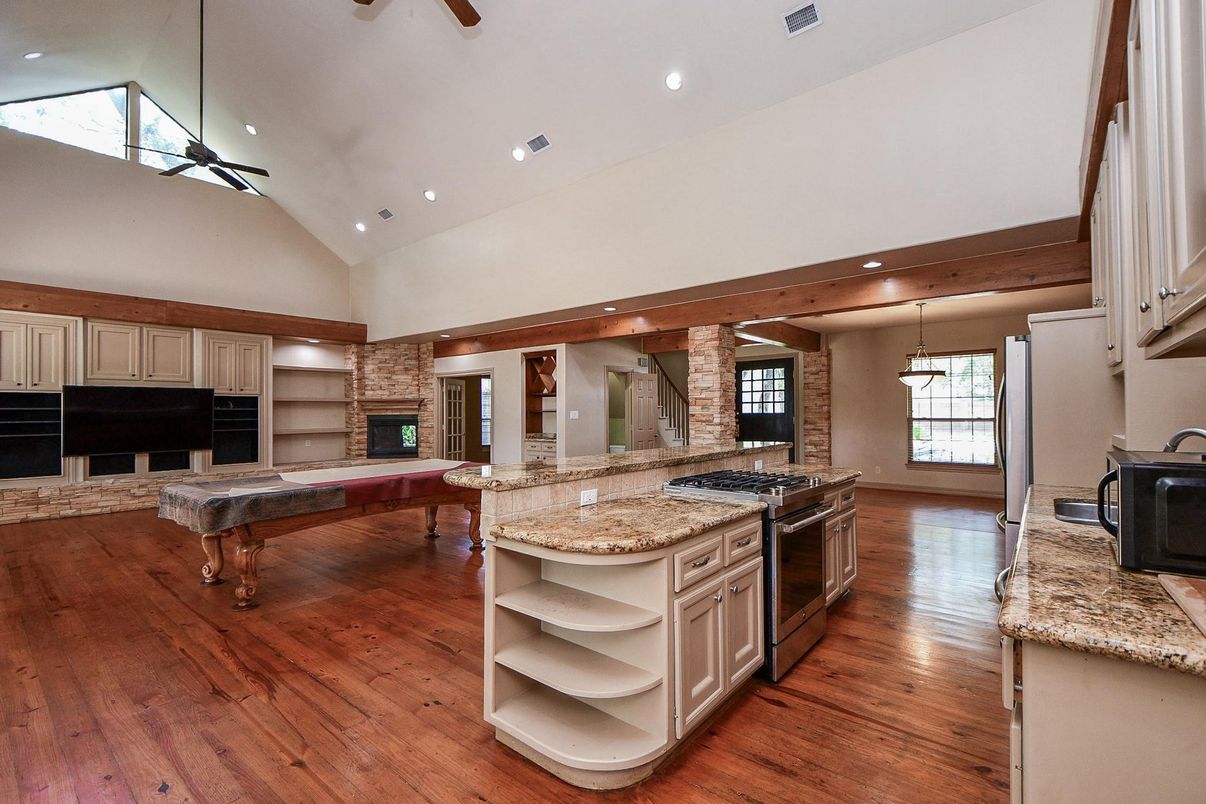 Fireplace, Interior, Kitchen, Recessed Lighting, Stone Walls, Wood Texture Flooring