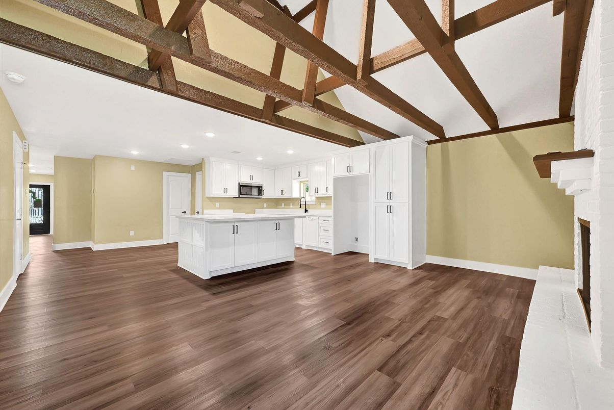 Empty room, Fireplace, Interior, Kitchen, Pendant Lights, Recessed Lighting, Wooden Beams, Wood Texture Flooring