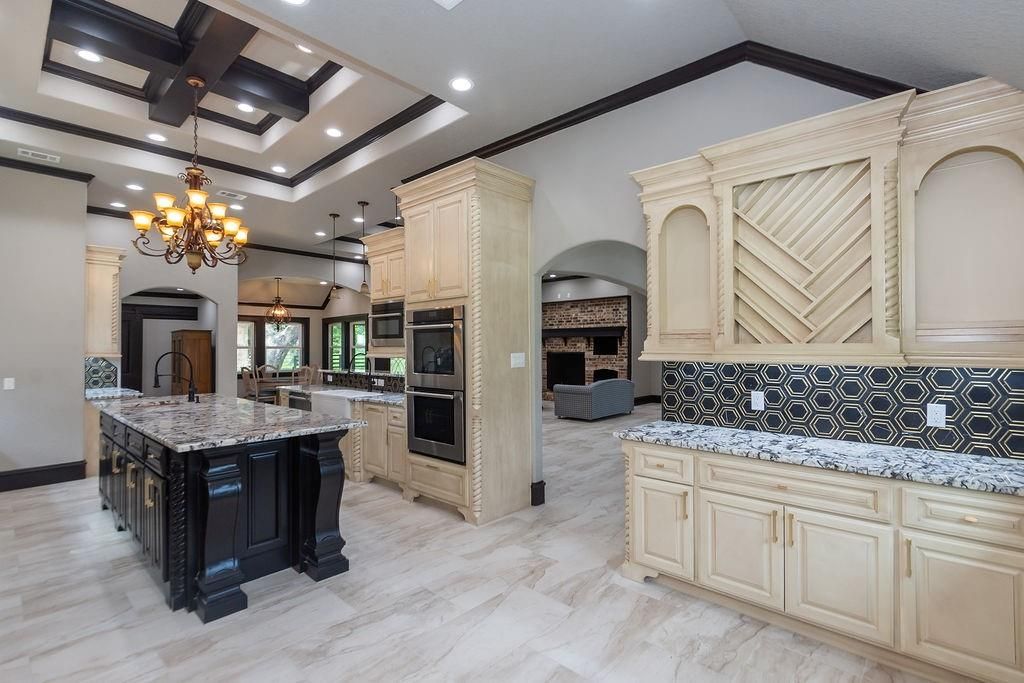 Chandelier, Fireplace, Interior, Kitchen, Marble, Pendant Lights, Recessed Lighting, Stainless Steel Appliances