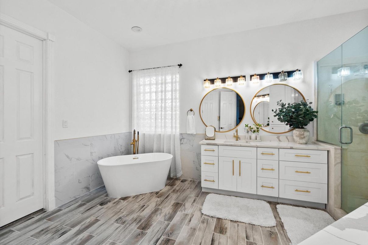 Bathroom, Dual Sink Vanities, Free Standing Baths, Glass Shower, Interior, Marble Walls, Wood Texture Flooring