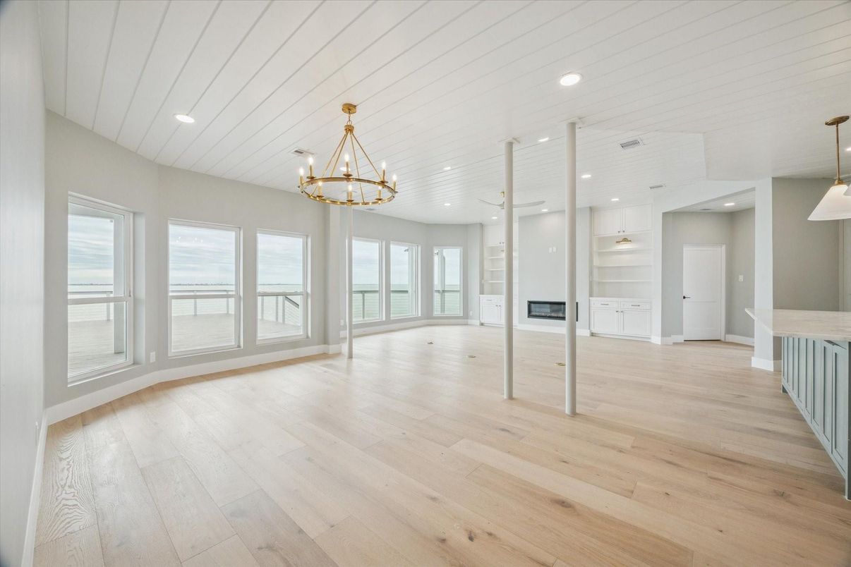 Chandelier, Empty room, Fireplace, Interior, Pendant Lights, Recessed Lighting, Wood Texture Flooring