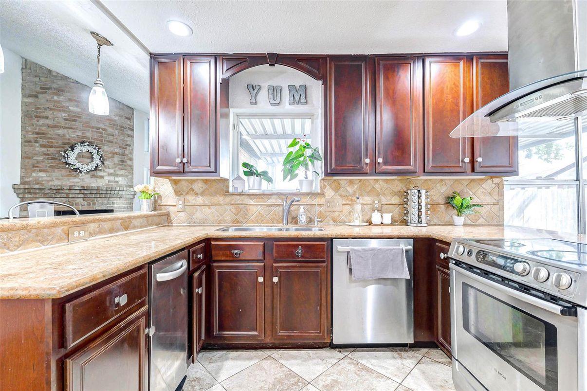 Interior, Kitchen, Pendant Lights, Recessed Lighting, Stainless Steel Appliances, Stone Walls
