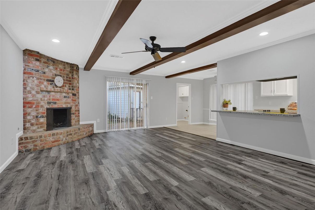 Empty room, Fireplace, Interior, Recessed Lighting, Stone Walls, Wooden Beams, Wood Texture Flooring