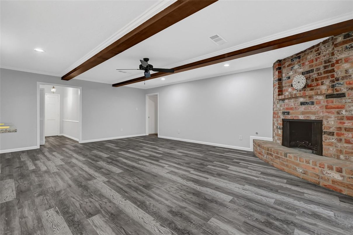 Empty room, Fireplace, Interior, Recessed Lighting, Stone Walls, Wooden Beams, Wood Texture Flooring