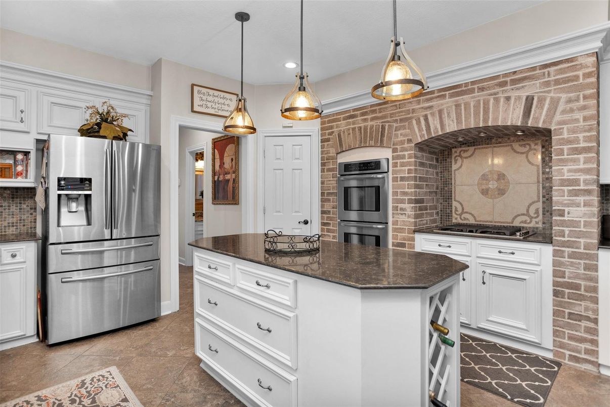 Interior, Kitchen, Pendant Lights, Recessed Lighting, Stainless Steel Appliances, Stone Walls