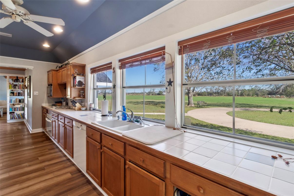 Interior, Kitchen, Recessed Lighting, Tile Countertops, Wood Texture Flooring