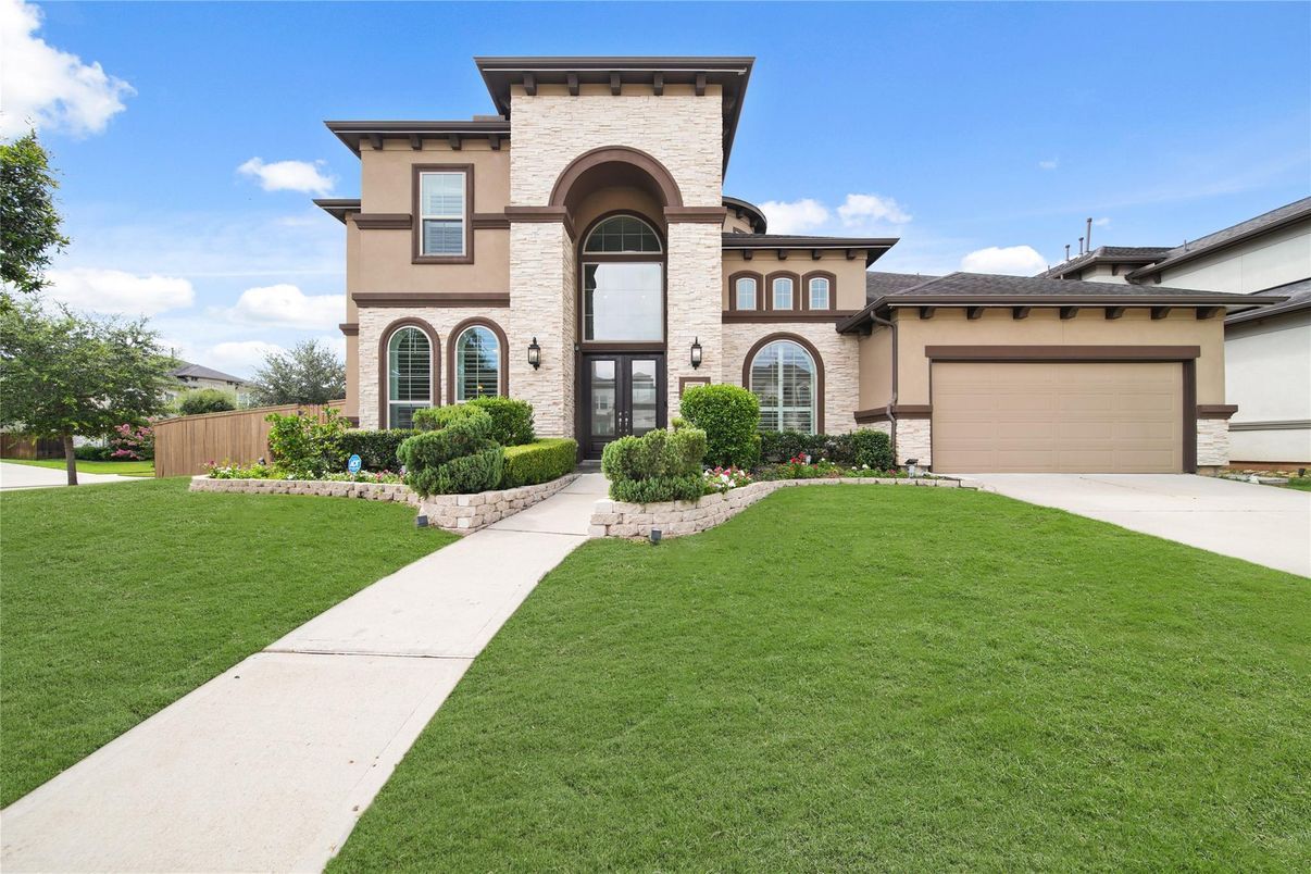 Attached, Backyard, Exterior, Facade, Brick Facade, Mediterranean