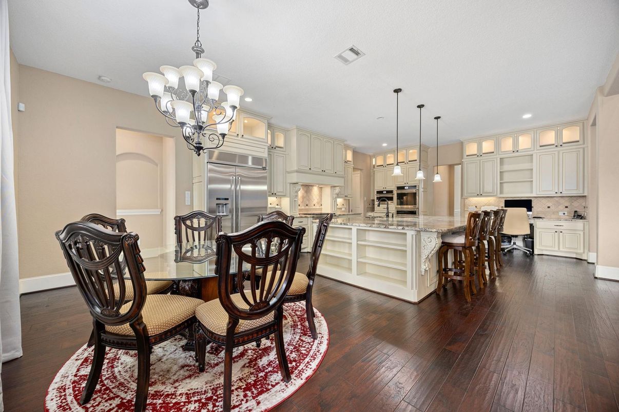 Chandelier, Dining room, Interior, Kitchen, Pendant Lights, Recessed Lighting, Stainless Steel Appliances, Wood Texture Flooring