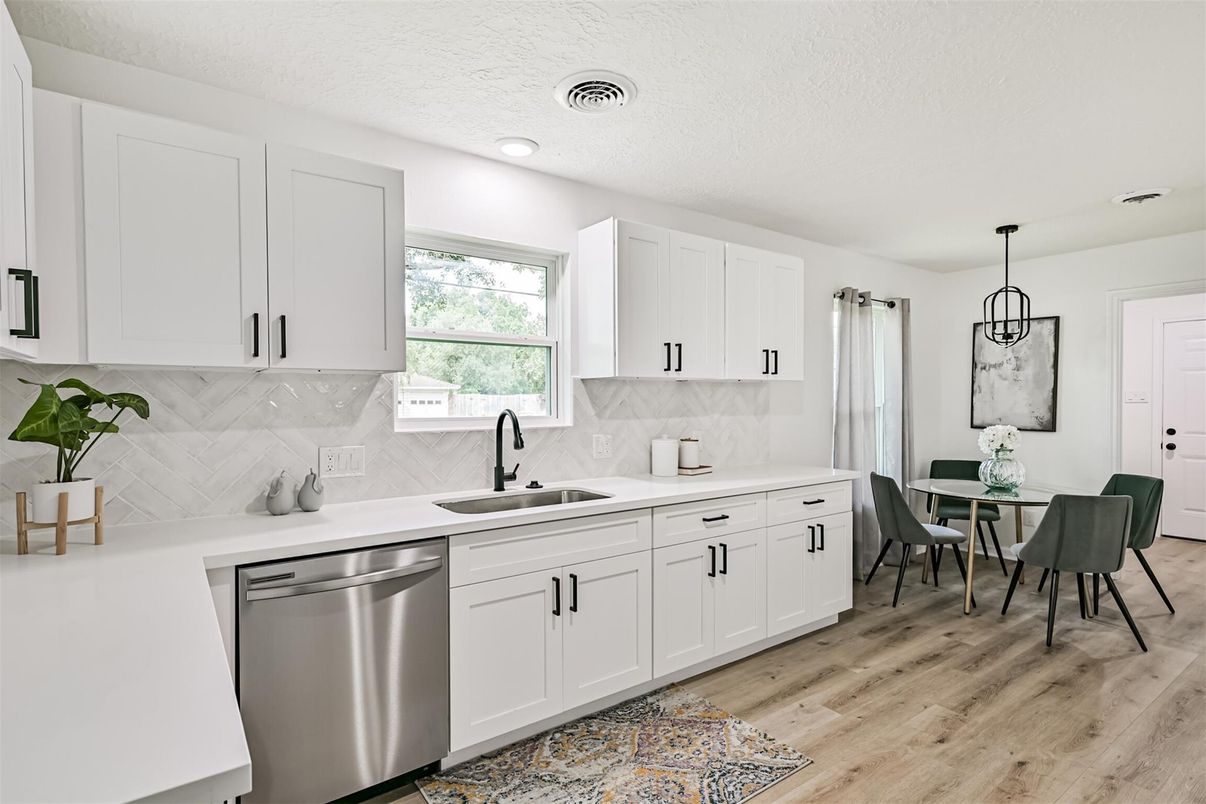 Dining room, Interior, Kitchen, Pendant Lights, Recessed Lighting, Stainless Steel Appliances, Wood Texture Flooring