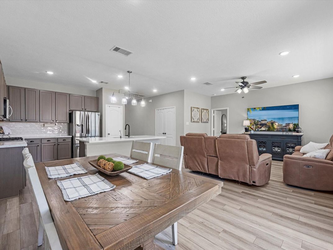 Dining room, Interior, Kitchen, Living room, Pendant Lights, Recessed Lighting, Stainless Steel Appliances, Wood Texture Flooring