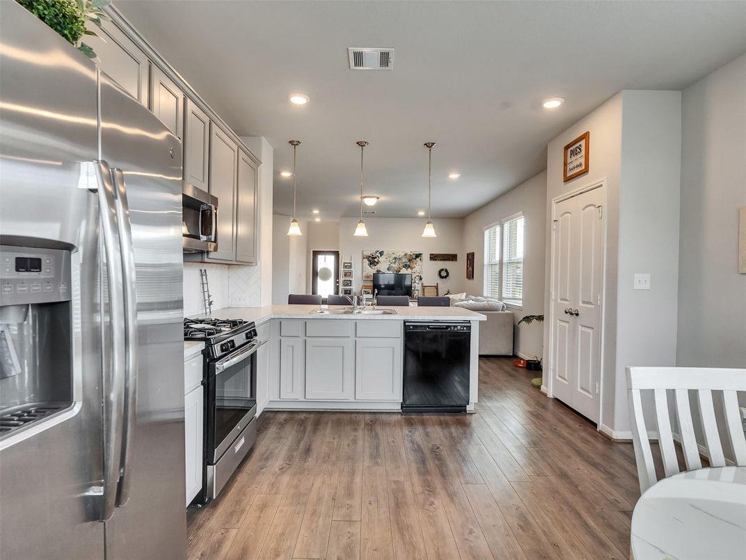 Interior, Kitchen, Pendant Lights, Recessed Lighting, Stainless Steel Appliances, Wood Texture Flooring