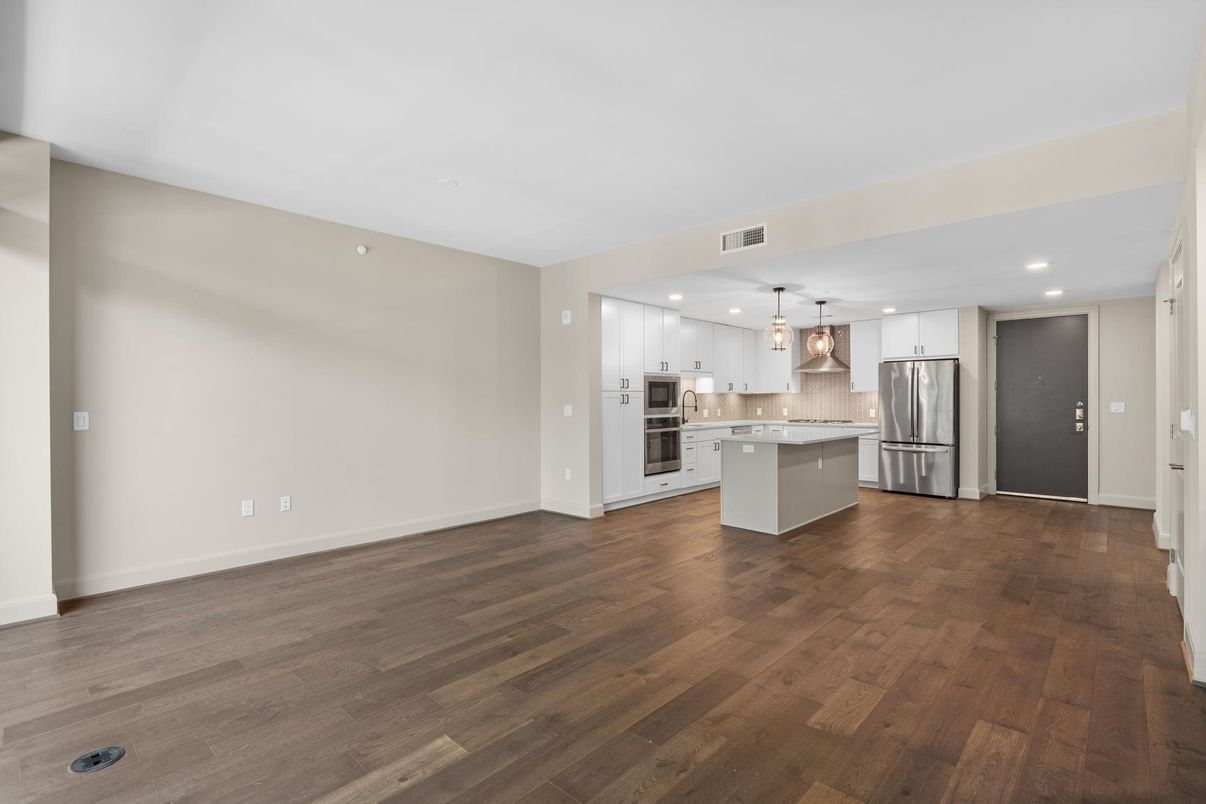 Empty room, Interior, Kitchen, Pendant Lights, Recessed Lighting, Stainless Steel Appliances, Wood Texture Flooring