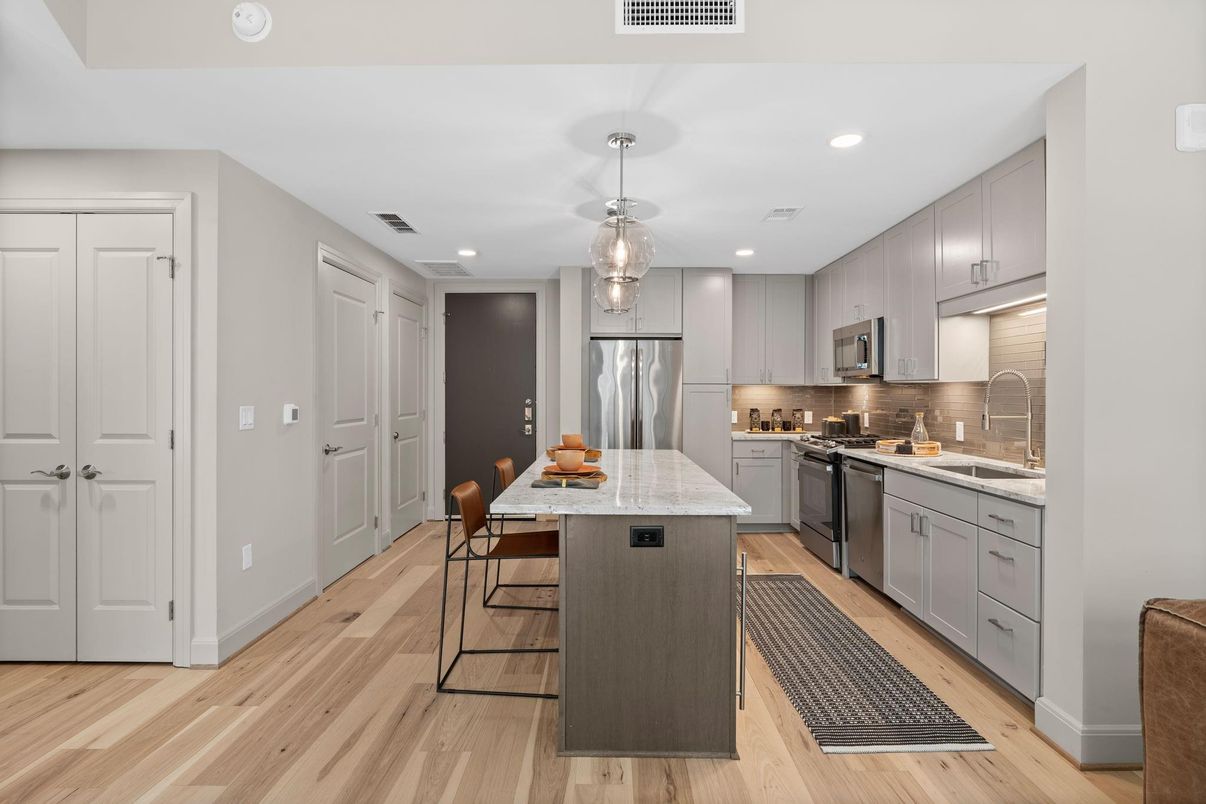 Dining room, Interior, Kitchen, Pendant Lights, Recessed Lighting, Stainless Steel Appliances, Wood Texture Flooring