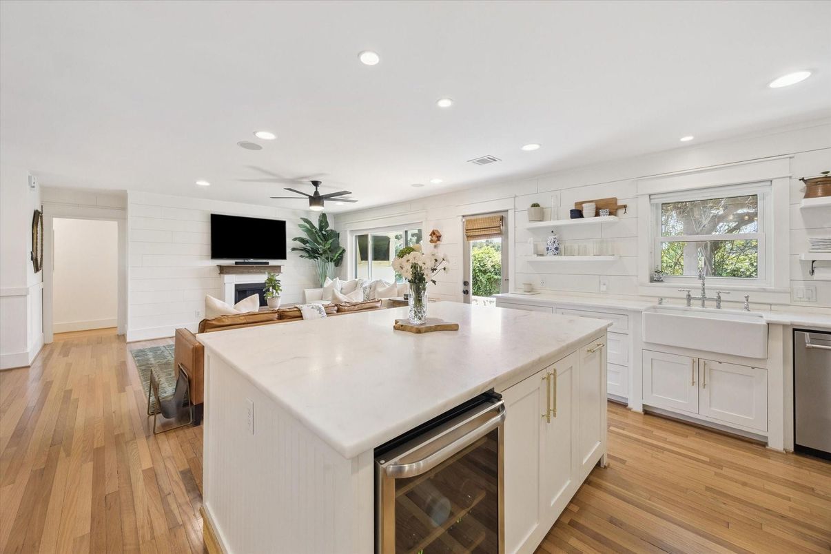 Fireplace, Interior, Kitchen, Recessed Lighting, Stainless Steel Appliances, Wood Texture Flooring