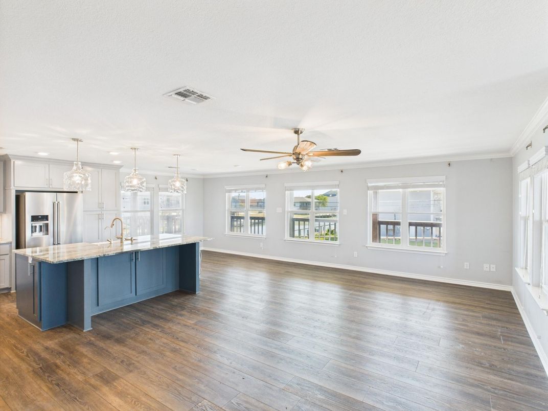 Empty room, Interior, Kitchen, Pendant Lights, Recessed Lighting, Stainless Steel Appliances, Wood Texture Flooring