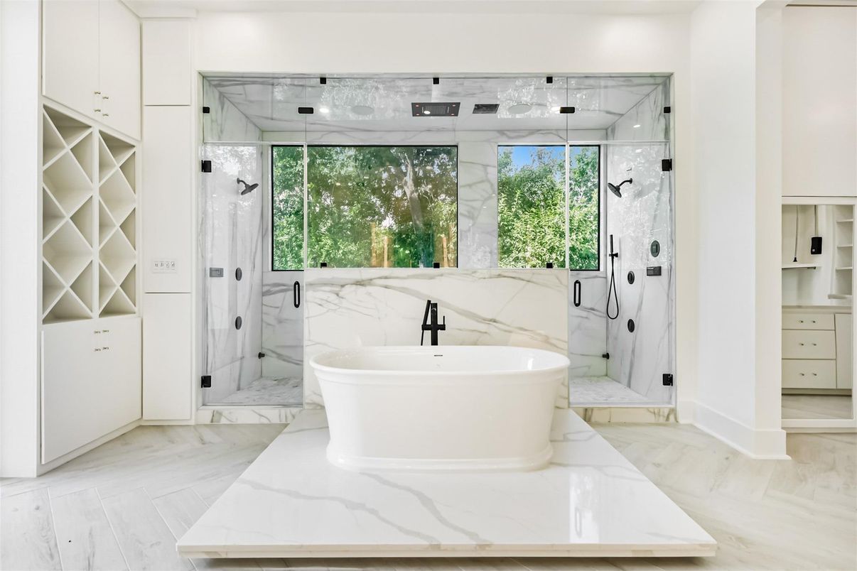 Bathroom, Free Standing Baths, Glass Shower, Interior, Marble, Marble Walls, Recessed Lighting, Wood Texture Flooring