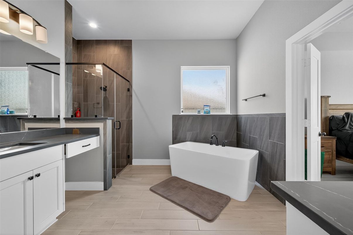 Bathroom, Free Standing Baths, Glass Shower, Interior, Recessed Lighting, Wood Texture Flooring