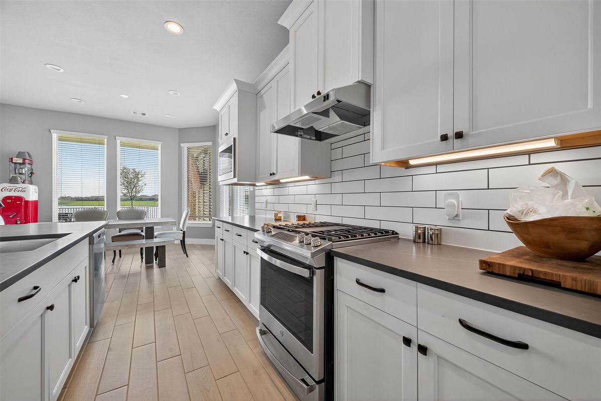 Dining room, Interior, Kitchen, Recessed Lighting, Stainless Steel Appliances, Wood Texture Flooring