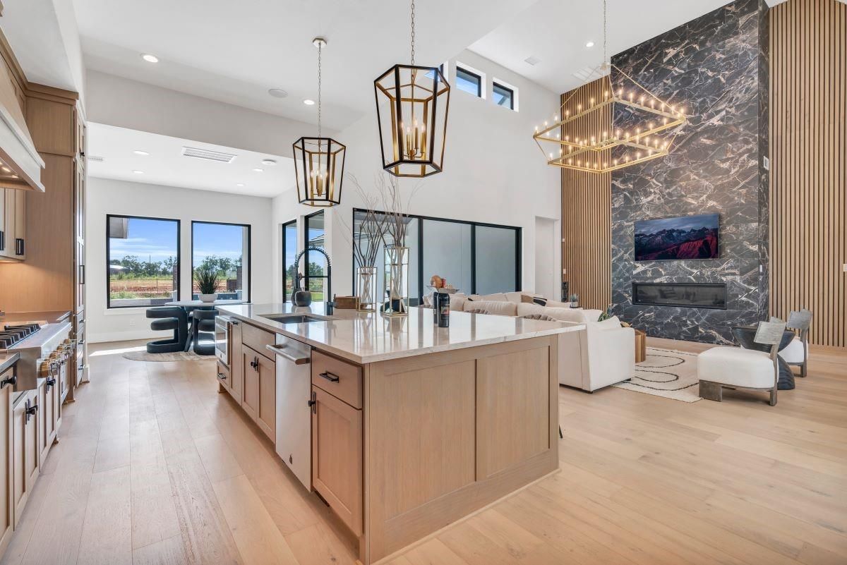Chandelier, Fireplace, Interior, Kitchen, Living room, Pendant Lights, Recessed Lighting, Wood Texture Flooring