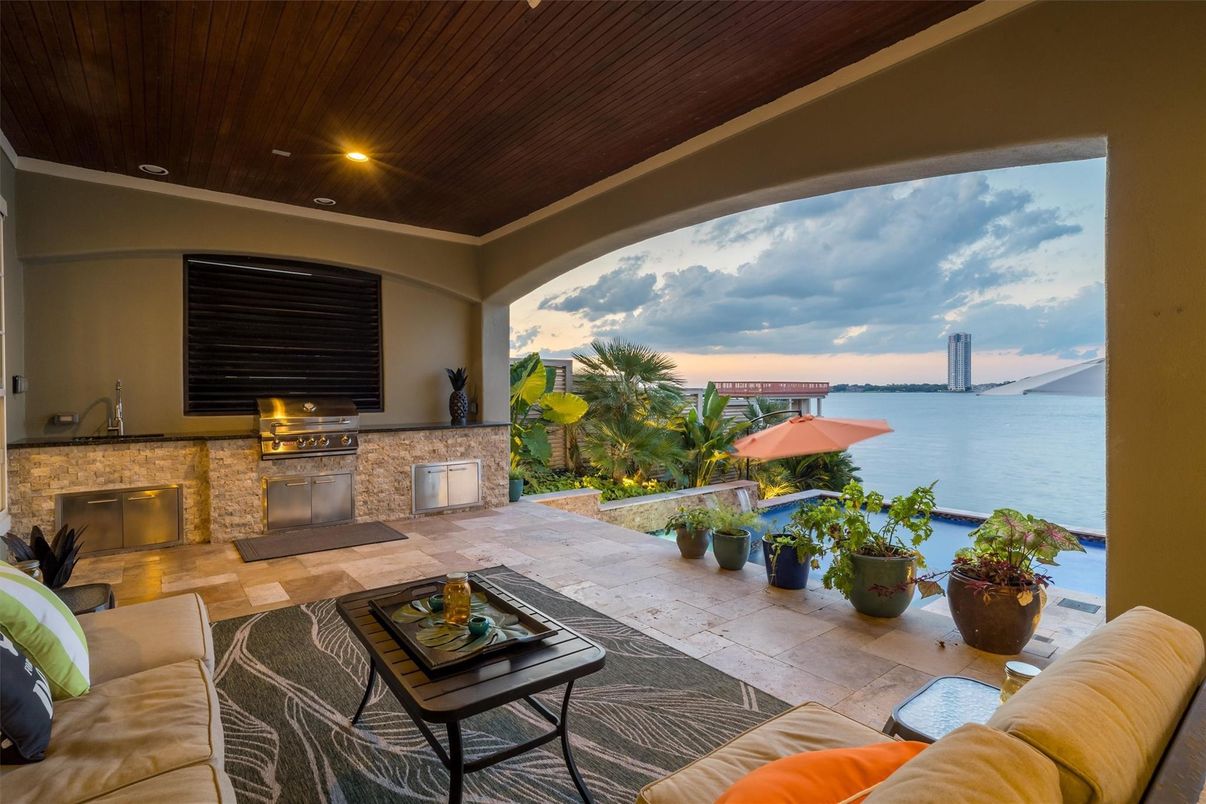 Exterior, Fireplace, Outdoor Kitchen, Water
