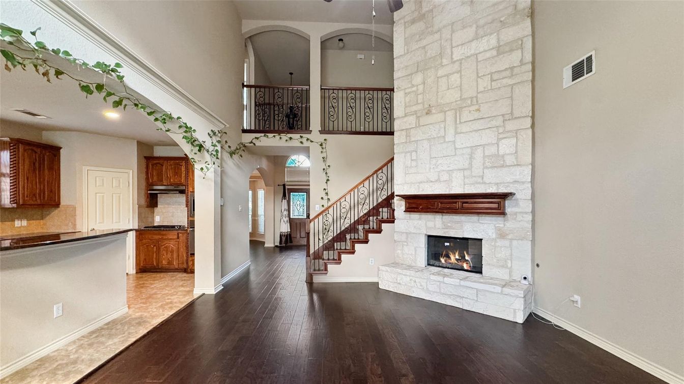 Fireplace, Interior, Kitchen, Recessed Lighting, Stone Walls, Wood Texture Flooring