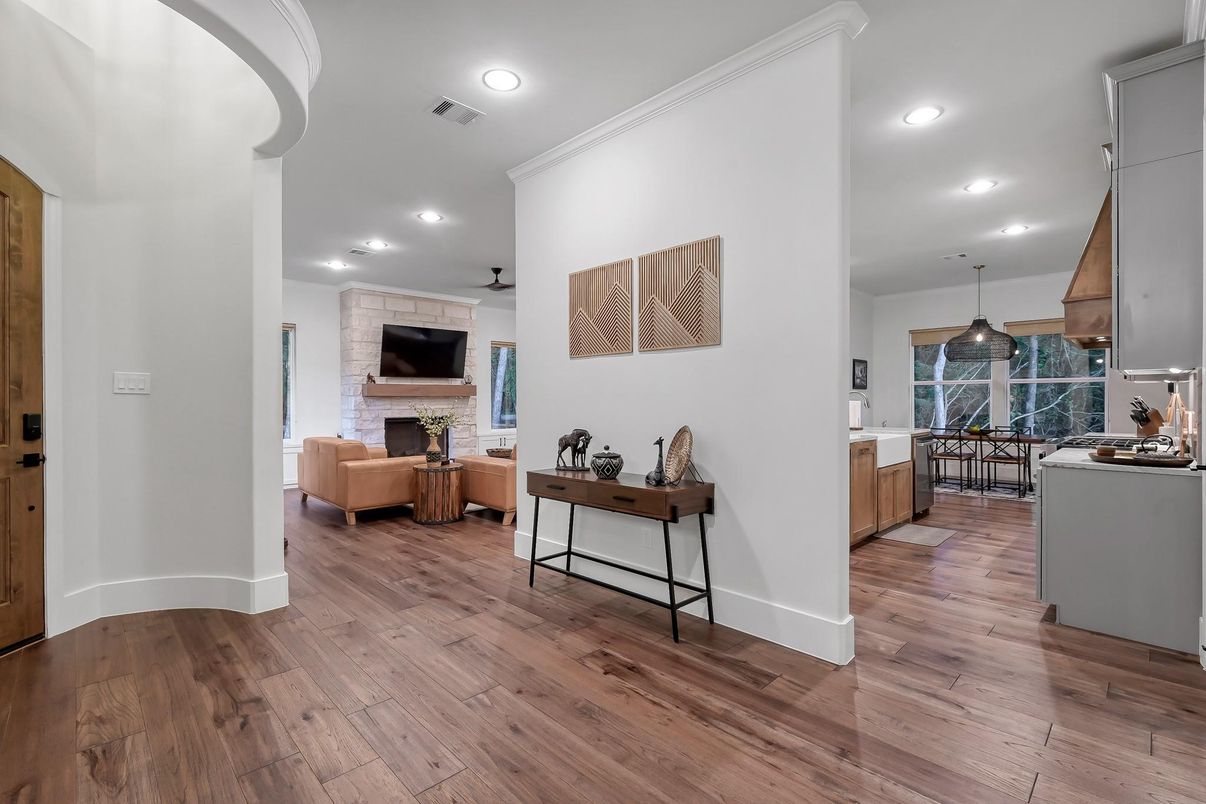 Dining room, Fireplace, Interior, Living room, Pendant Lights, Recessed Lighting, Stone Walls, Wood Texture Flooring