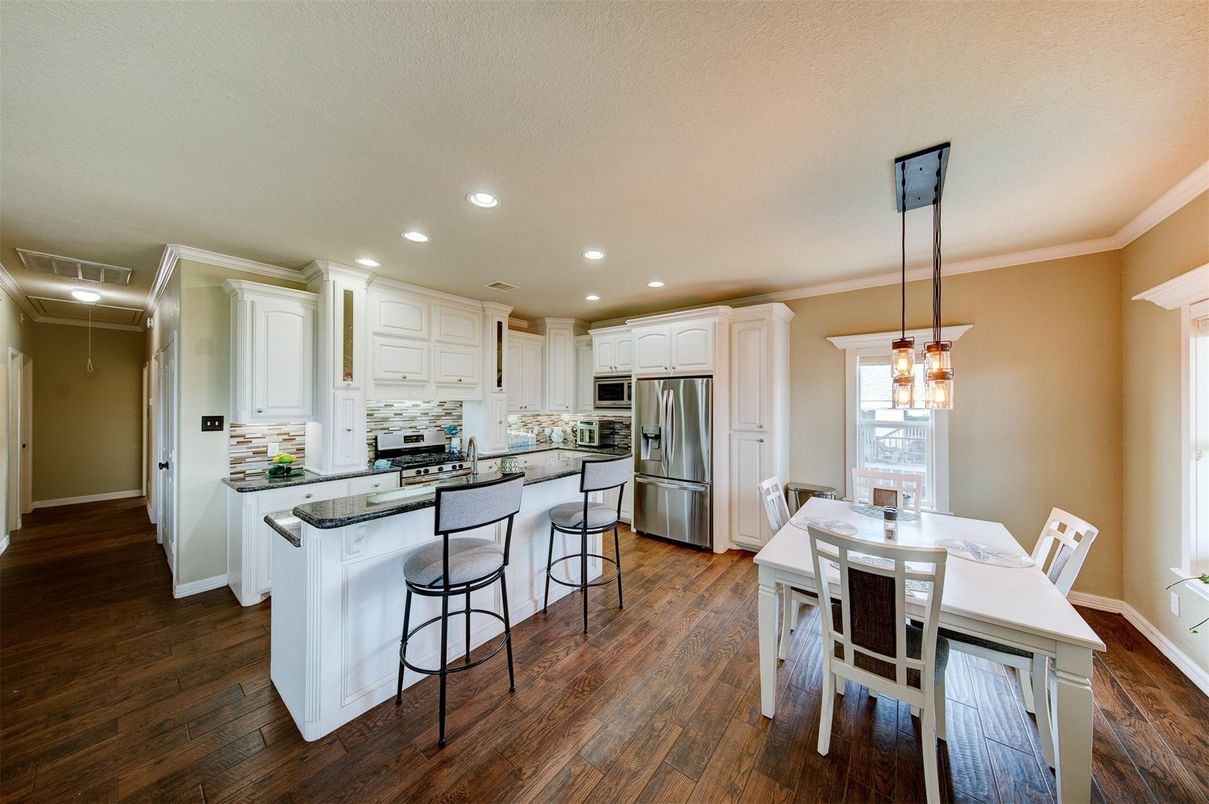 Dining room, Interior, Kitchen, Pendant Lights, Recessed Lighting, Stainless Steel Appliances, Wood Texture Flooring