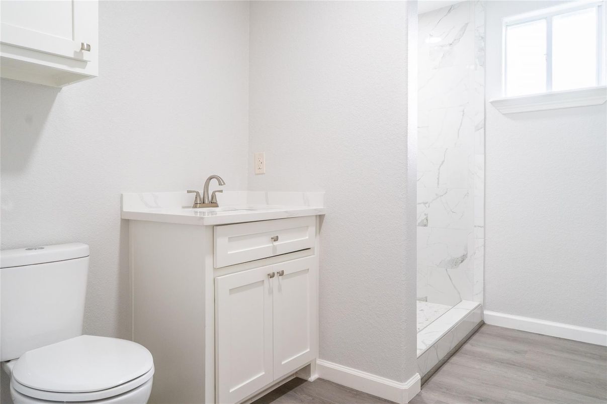 Bathroom, Glass Shower, Interior, Marble Walls, Wood Texture Flooring