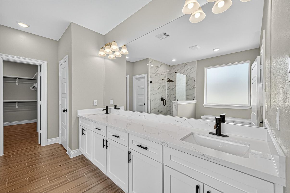 Bathroom, Dual Sink Vanities, Interior, Marble Walls, Recessed Lighting, Wood Texture Flooring