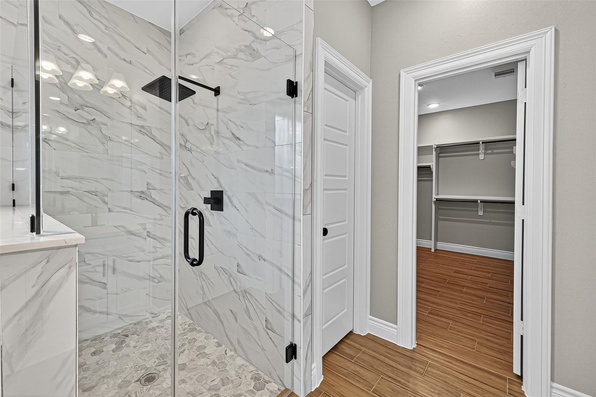 Bathroom, Glass Shower, Interior, Marble Walls, Recessed Lighting, Walk-in Closets, Wood Texture Flooring