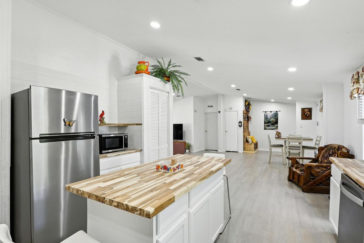 Dining room, Interior, Kitchen, Recessed Lighting, Stainless Steel Appliances, Wood Texture Flooring