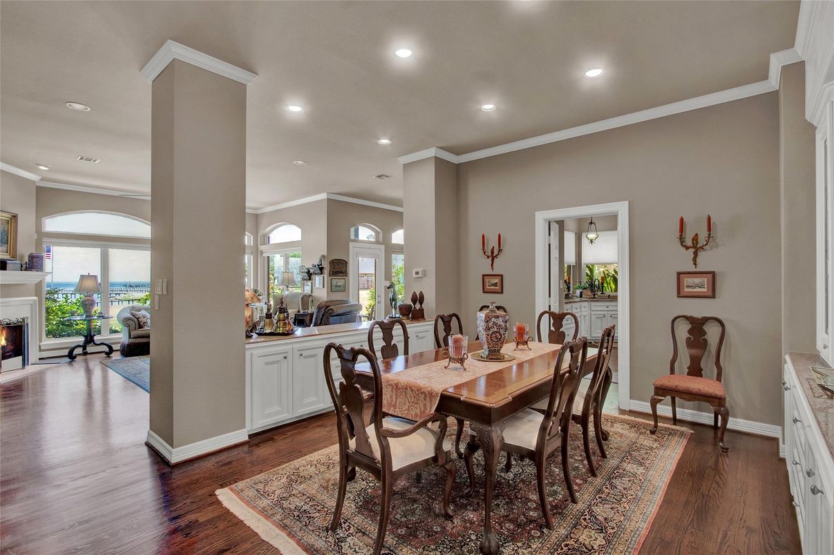 Dining room, Fireplace, Interior, Living room, Recessed Lighting, Wood Texture Flooring