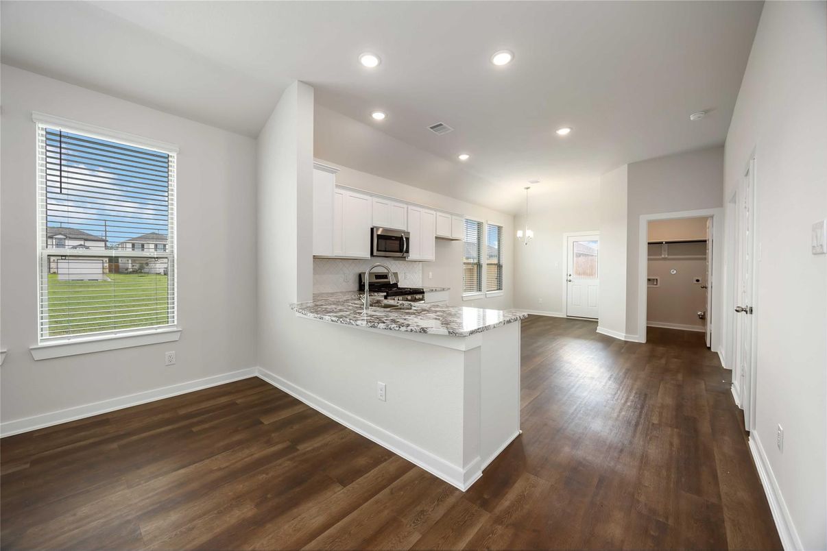 Chandelier, Empty room, Interior, Kitchen, Pendant Lights, Recessed Lighting, Stainless Steel Appliances, Wood Texture Flooring