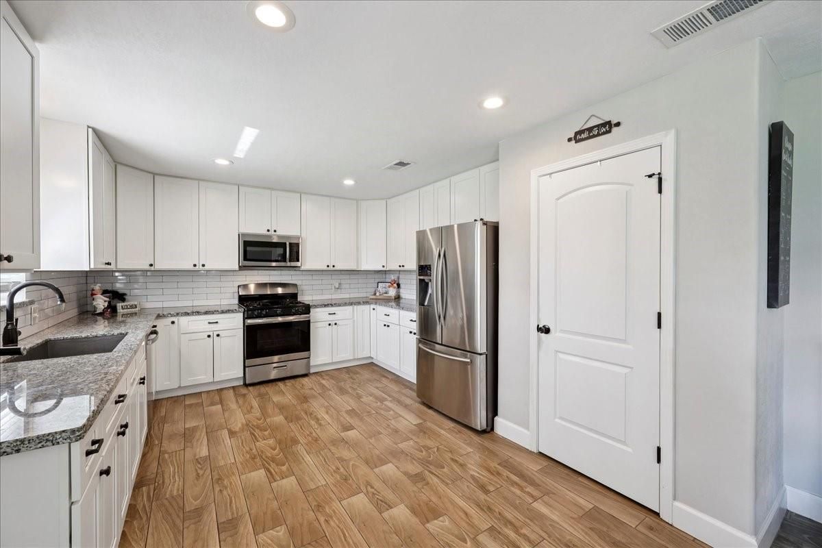 Interior, Kitchen, Recessed Lighting, Stainless Steel Appliances, Wood Texture Flooring
