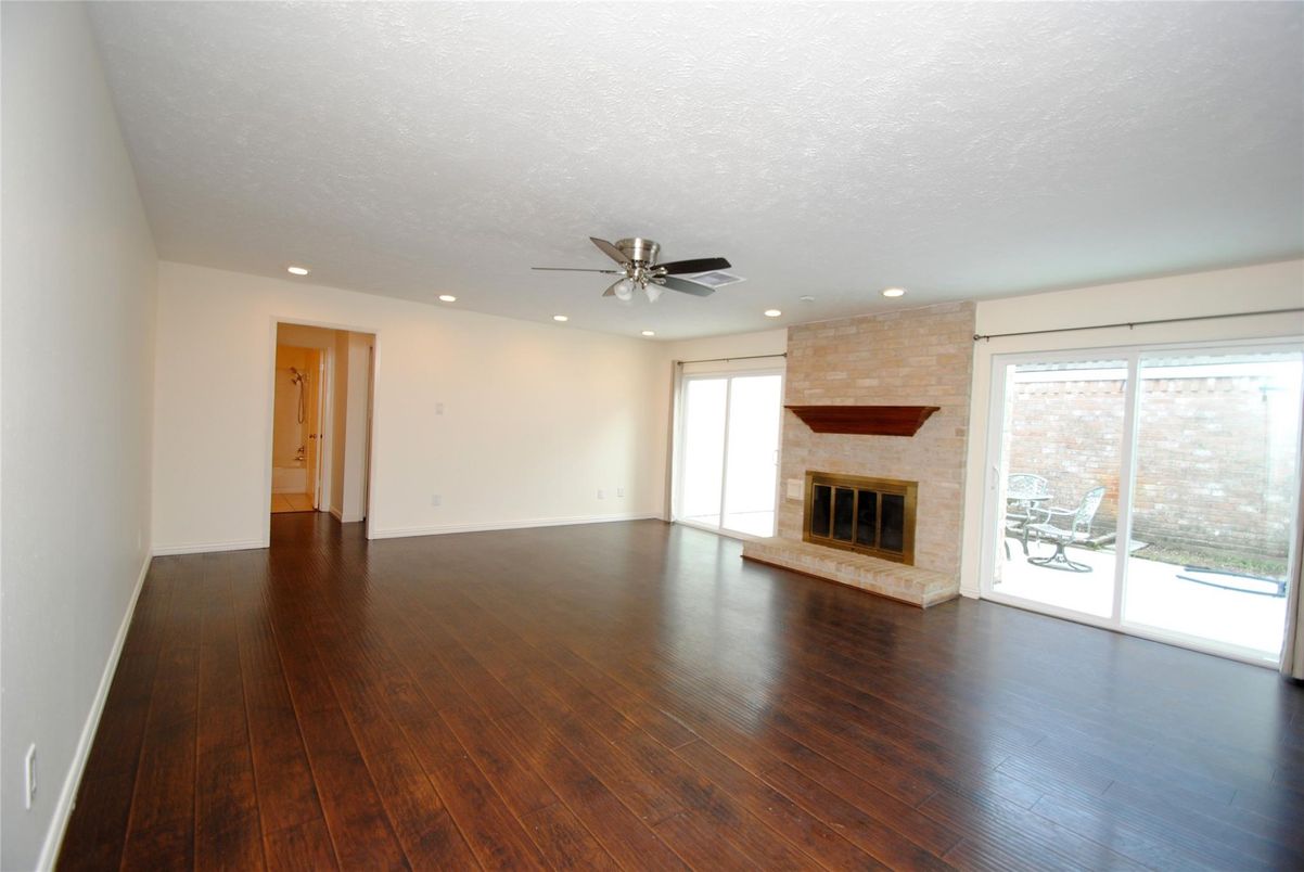Empty room, Fireplace, Interior, Recessed Lighting, Wood Texture Flooring
