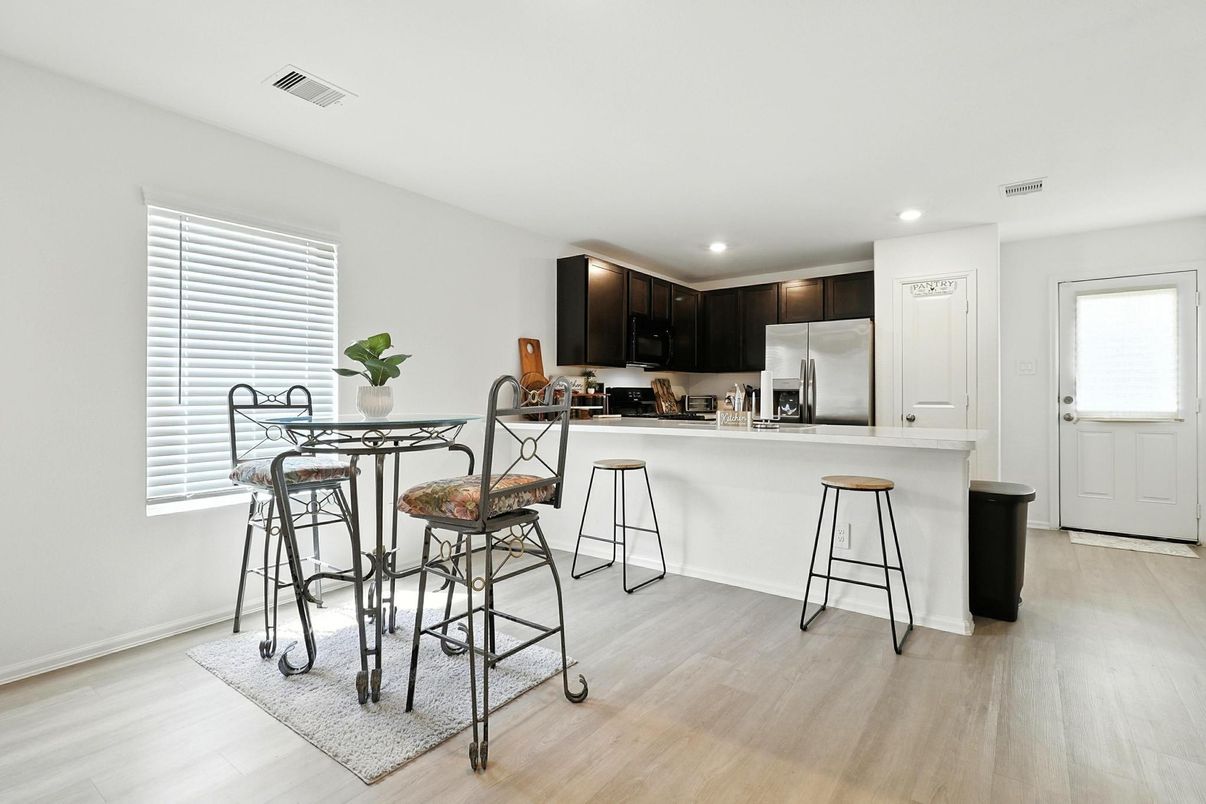 Dining room, Interior, Kitchen, Recessed Lighting, Stainless Steel Appliances, Wood Texture Flooring