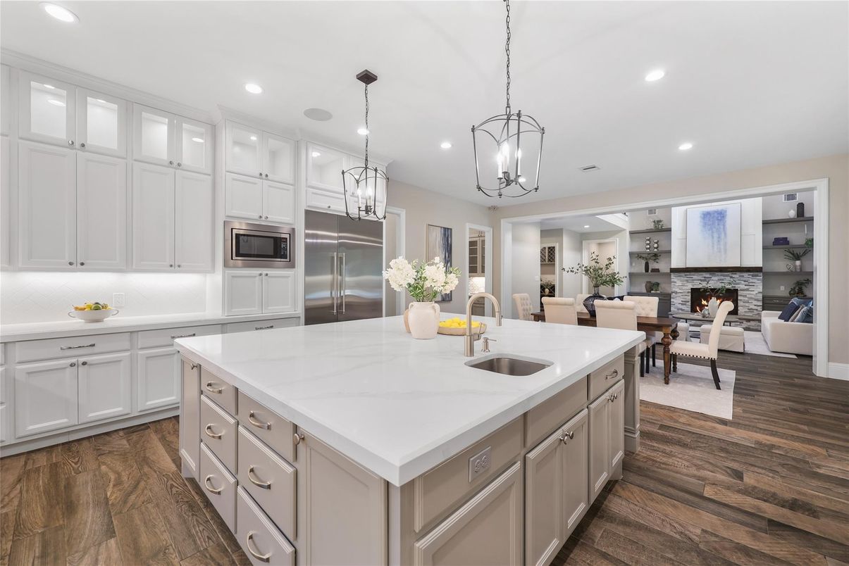 Dining room, Fireplace, Interior, Kitchen, Living room, Pendant Lights, Recessed Lighting, Stainless Steel Appliances, Wood Texture Flooring