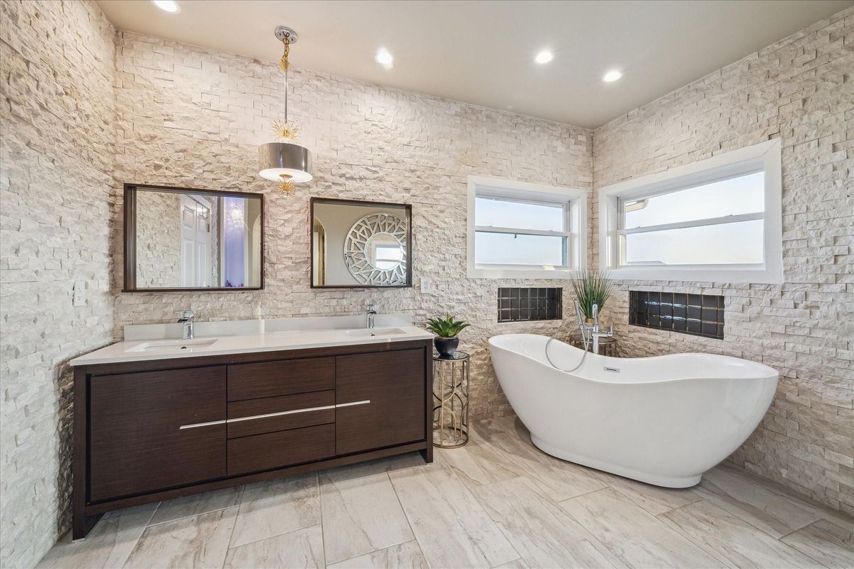 Bathroom, Dual Sink Vanities, Free Standing Baths, Interior, Pendant Lights, Recessed Lighting, Stone Walls