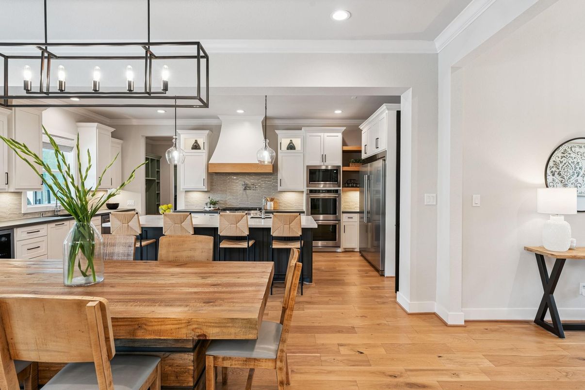 Dining room, Interior, Kitchen, Pendant Lights, Recessed Lighting, Stainless Steel Appliances, Wood Texture Flooring