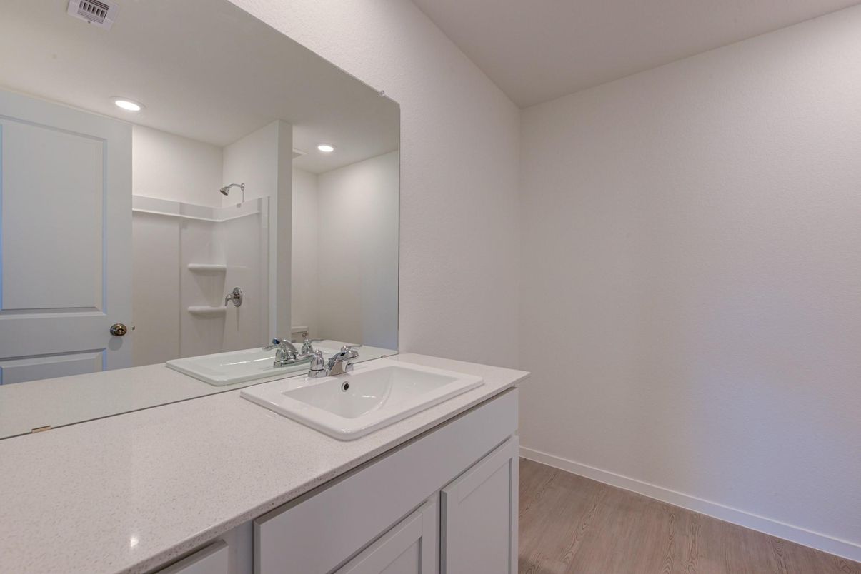 Bathroom, Dual Sink Vanities, Interior, Recessed Lighting, Wood Texture Flooring