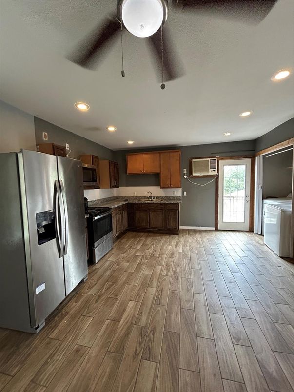 Interior, Kitchen, Recessed Lighting, Washer, Wood Texture Flooring