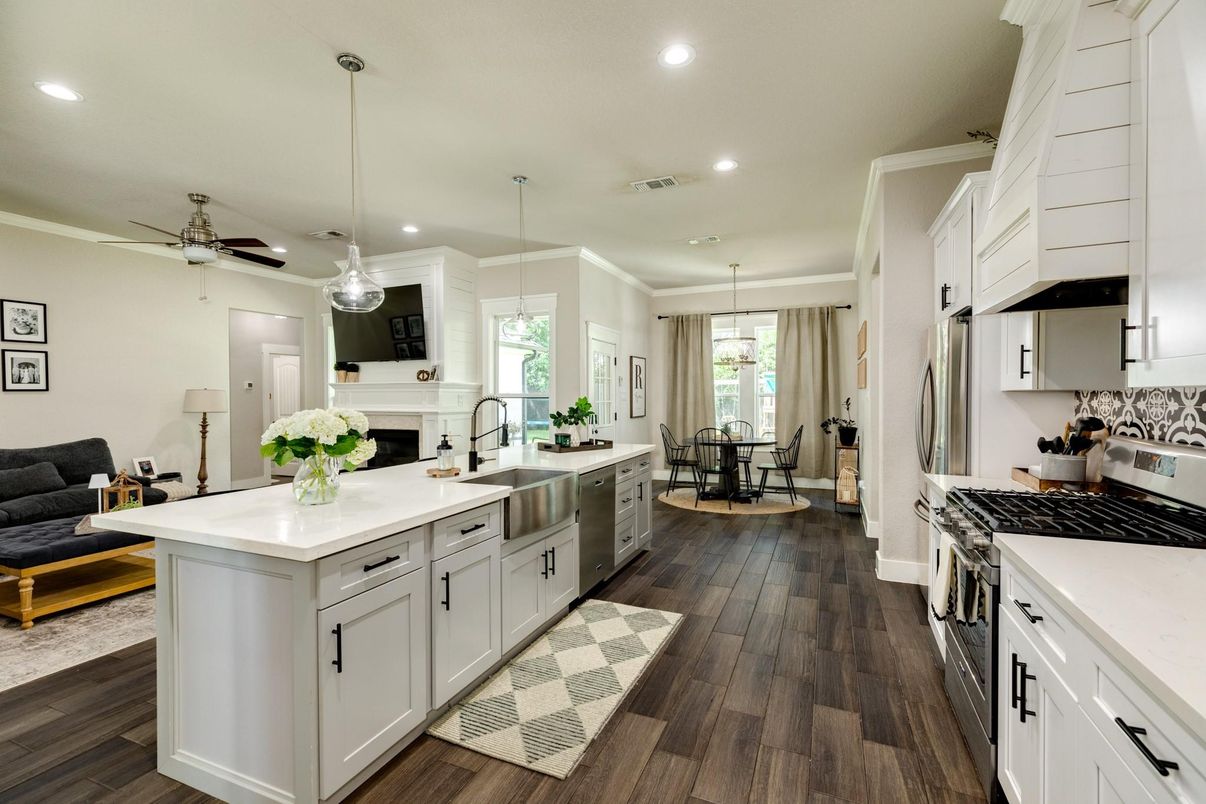 Dining room, Fireplace, Interior, Kitchen, Pendant Lights, Recessed Lighting, Stainless Steel Appliances, Wood Texture Flooring