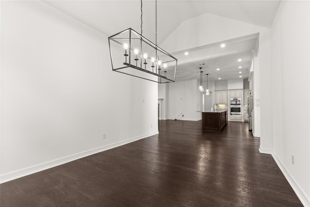 Empty room, Interior, Kitchen, Pendant Lights, Recessed Lighting, Stainless Steel Appliances, Wood Texture Flooring