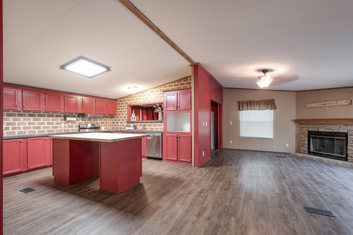 Fireplace, Interior, Kitchen, Stainless Steel Appliances, Stone Walls, Wood Texture Flooring